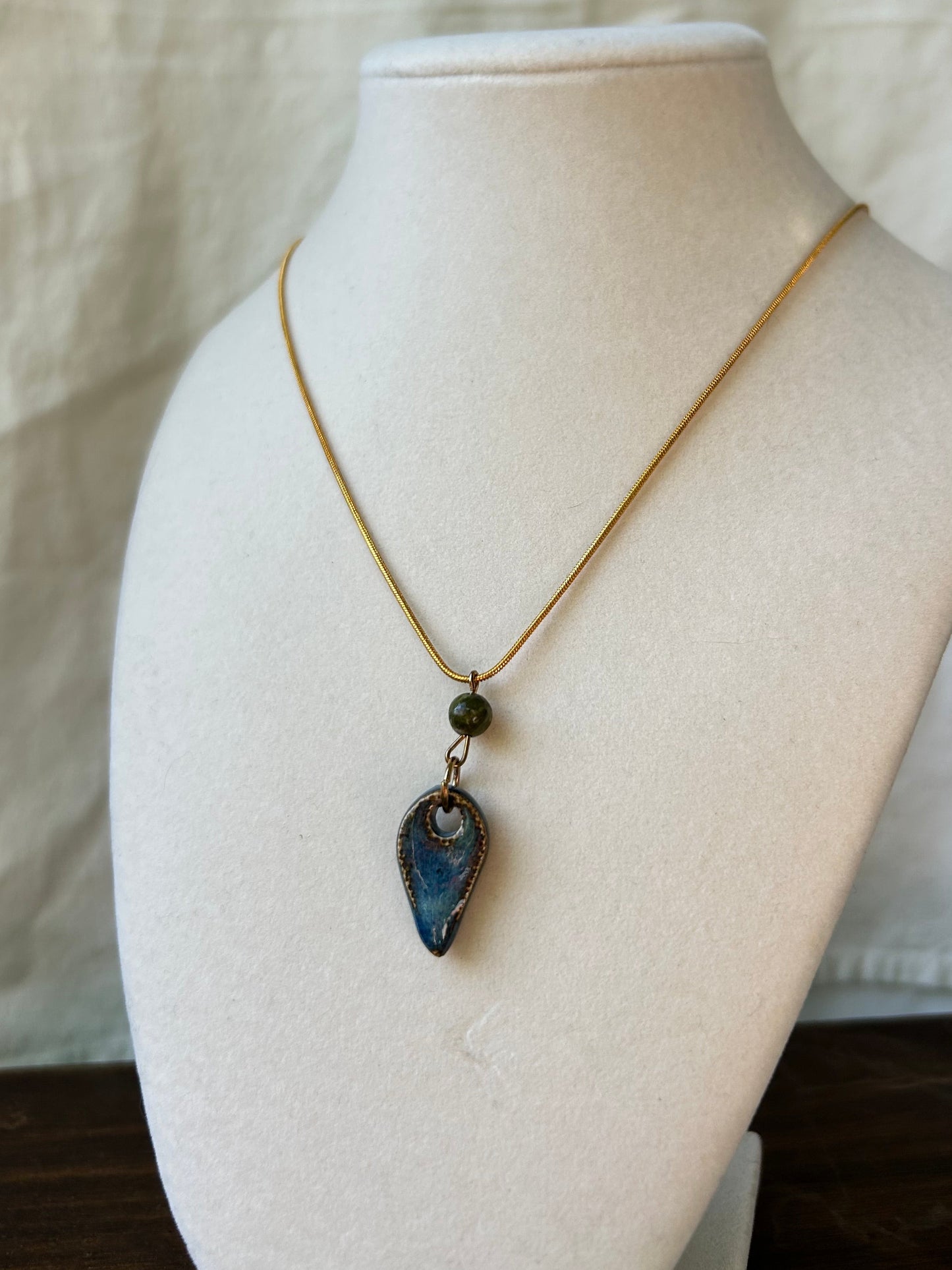 Green Bead Tooth Pendant