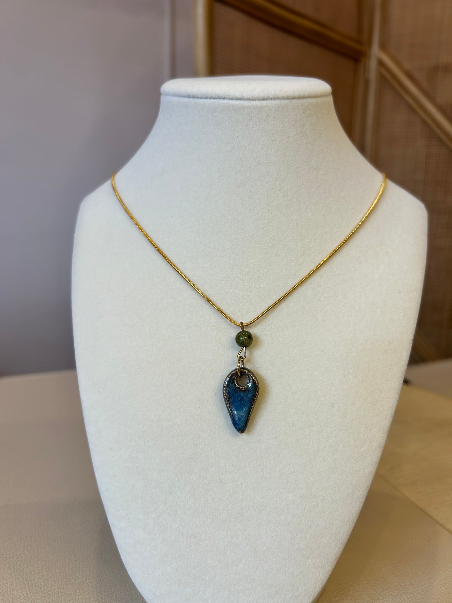 Green Bead Tooth Pendant