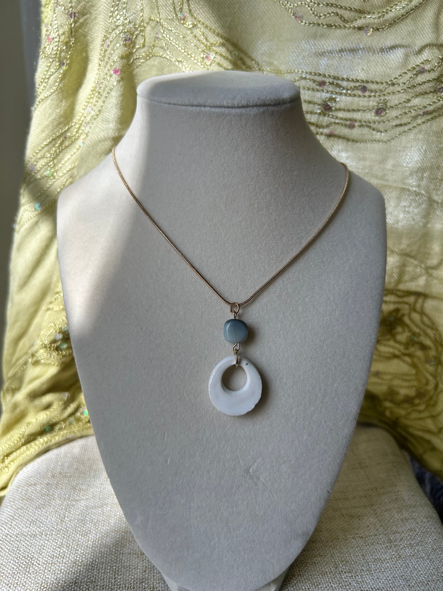 White stone pendant