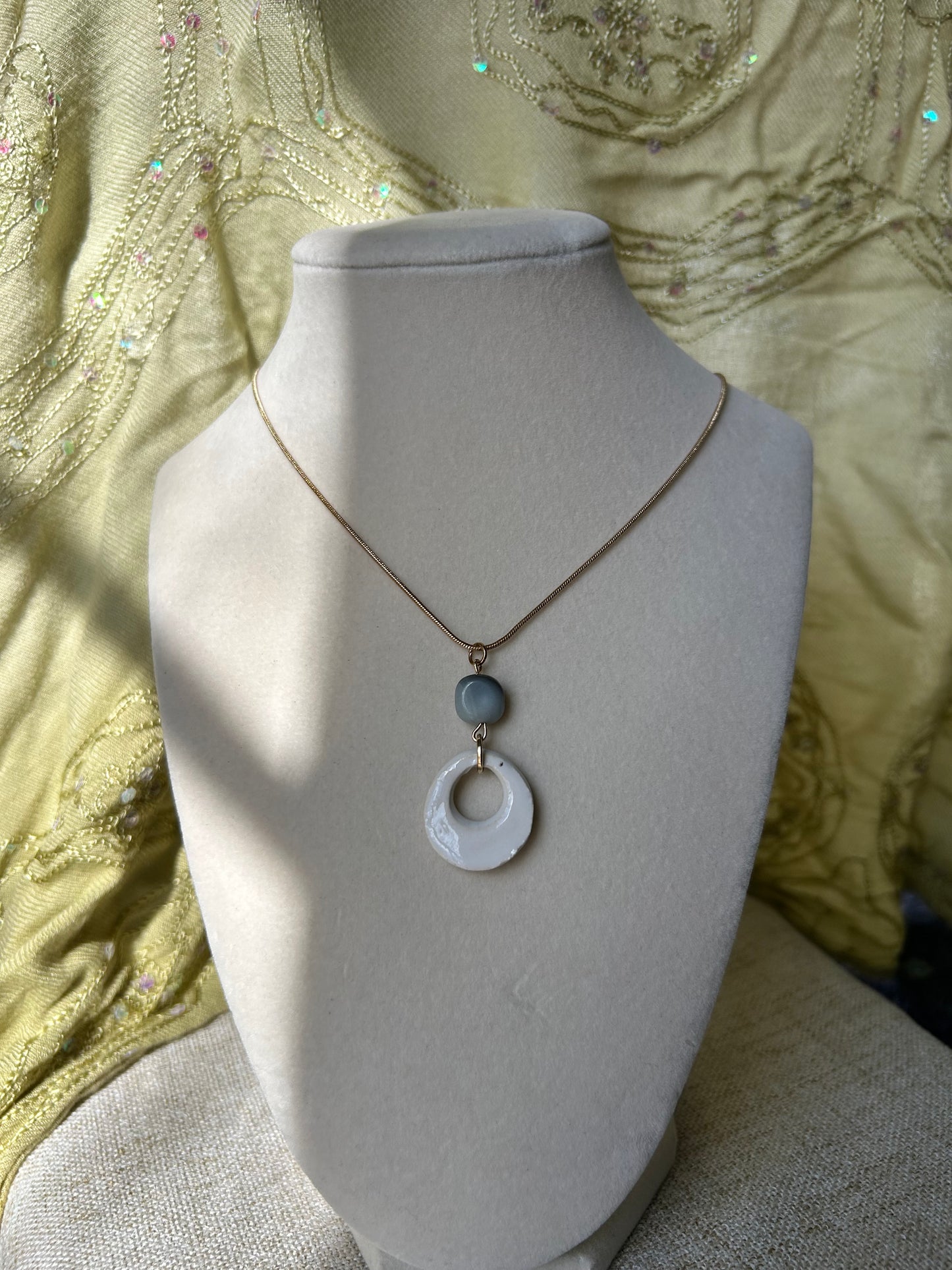 White stone pendant