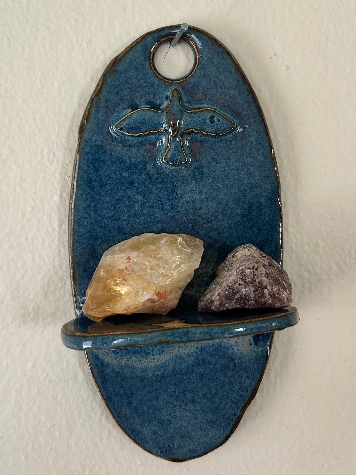 Lone bird shelf