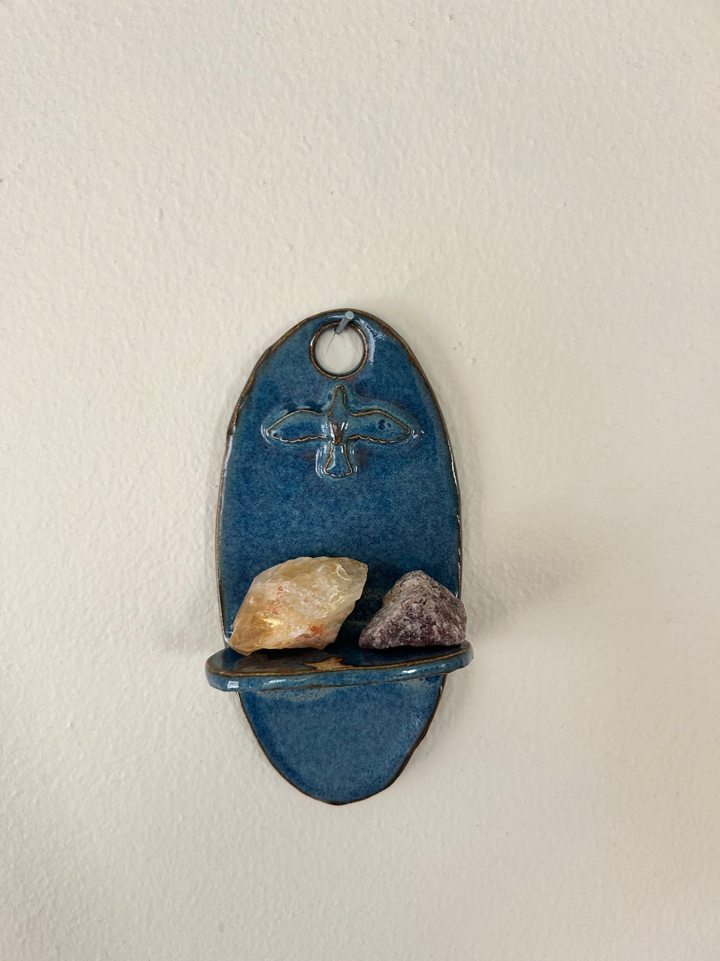 Lone bird shelf