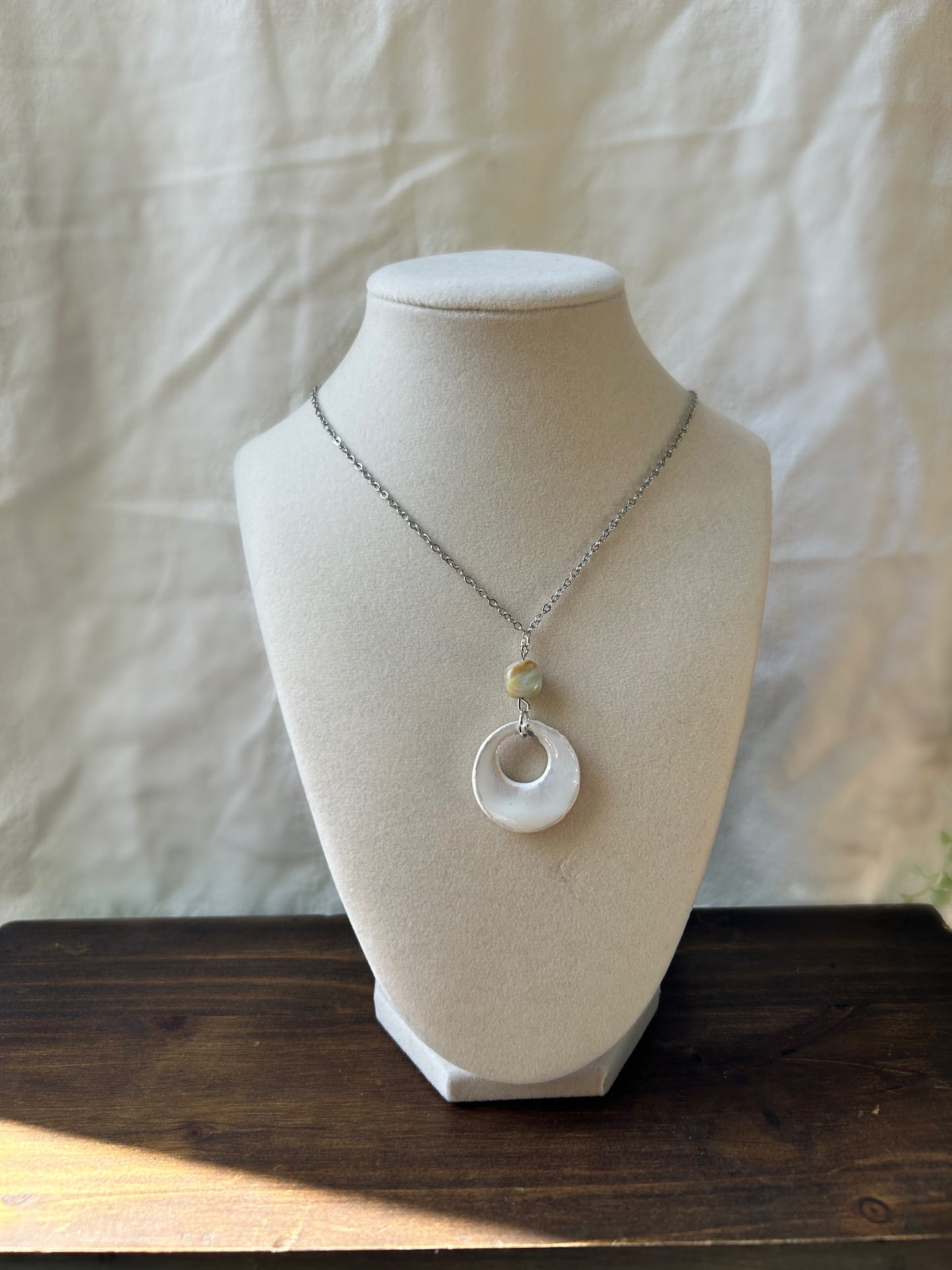 White stone pendant